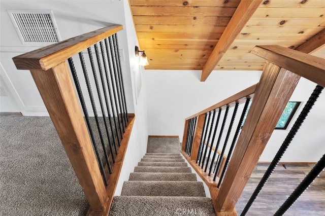 33198 Arrowbear Dr, Running Springs, CA 92382 - stairway featuring a wood ceiling with exposed beams and carpet flooring