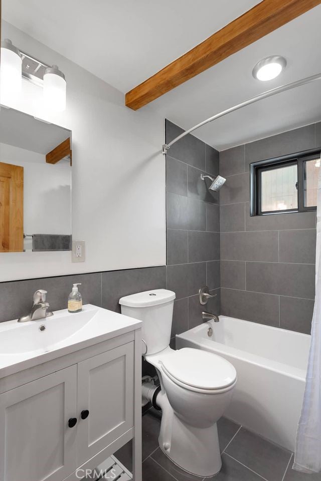 33198 Arrowbear Dr, Running Springs, CA 92382 - bathroom with tile walls, tile patterned flooring, vanity, shower / tub combo, and beam ceiling