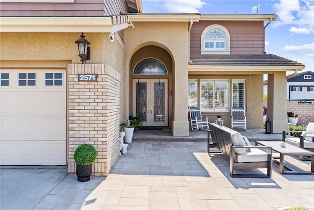 2571 Stetson Dr, Norco, CA 92860 - doorway to property featuring french doors, stucco siding, and a garage