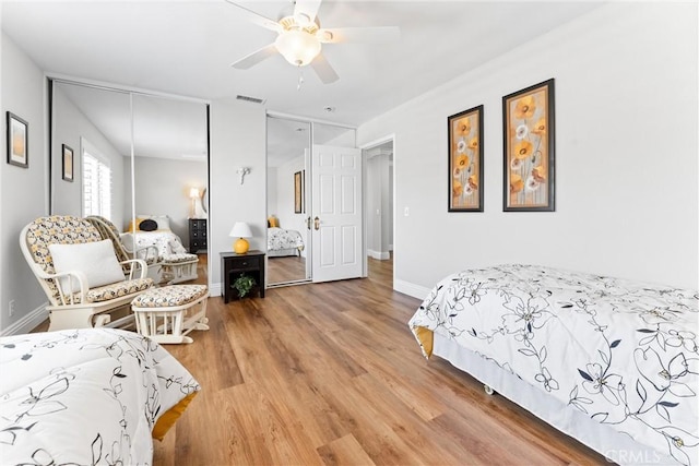 2571 Stetson Dr, Norco, CA 92860 - bedroom with multiple closets, wood finished floors, and ceiling fan