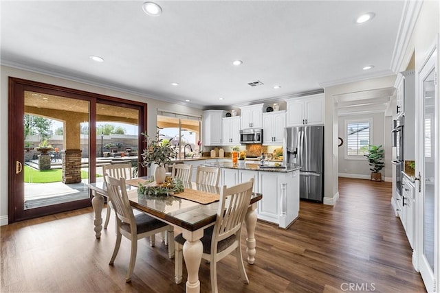 2571 Stetson Dr, Norco, CA 92860 - dining space with crown molding, dark wood-type flooring, and recessed lighting