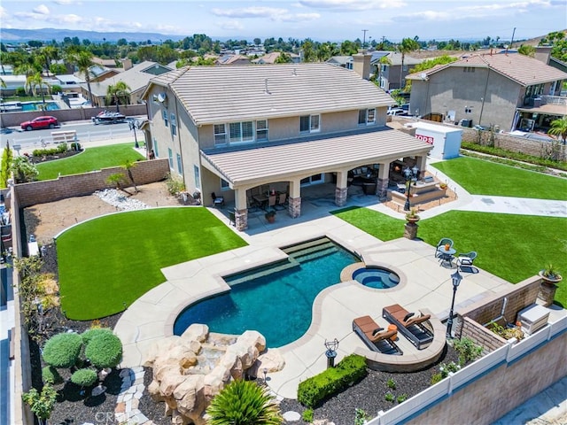 2571 Stetson Dr, Norco, CA 92860 - view of swimming pool featuring a fenced backyard, a patio, a residential view, and a pool with connected hot tub