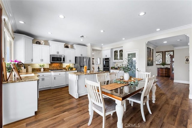 2571 Stetson Dr, Norco, CA 92860 - dining room featuring recessed lighting, dark wood-style floors, and ornamental molding