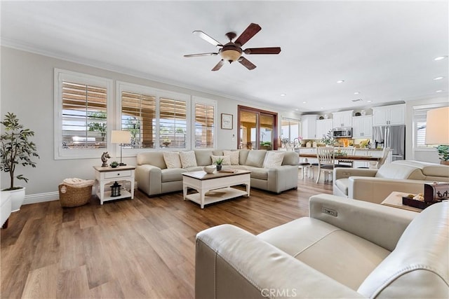 2571 Stetson Dr, Norco, CA 92860 - living room with a ceiling fan, plenty of natural light, crown molding, recessed lighting, and light wood-type flooring