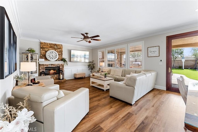 2571 Stetson Dr, Norco, CA 92860 - living area with ceiling fan, wood finished floors, crown molding, and a fireplace