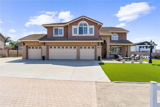 2571 Stetson Dr, Norco, CA 92860 - view of front facade with concrete driveway, a garage, an outdoor hangout area, and brick siding