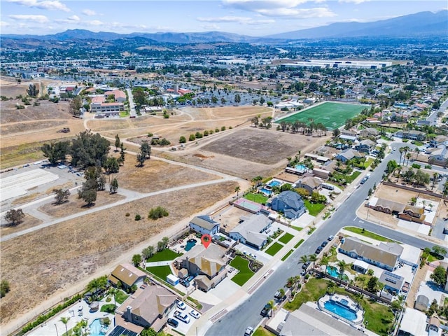 2571 Stetson Dr, Norco, CA 92860 - aerial view of property and surrounding area featuring a mountain backdrop and nearby suburban area