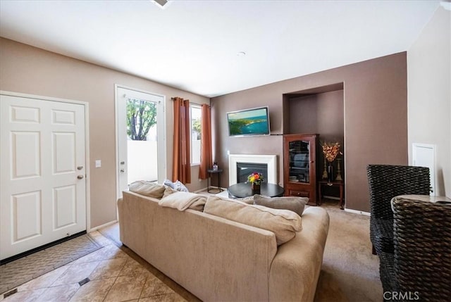 29767 Ascella Ln, Murrieta, CA 92563 - living area featuring a glass covered fireplace and light tile patterned floors