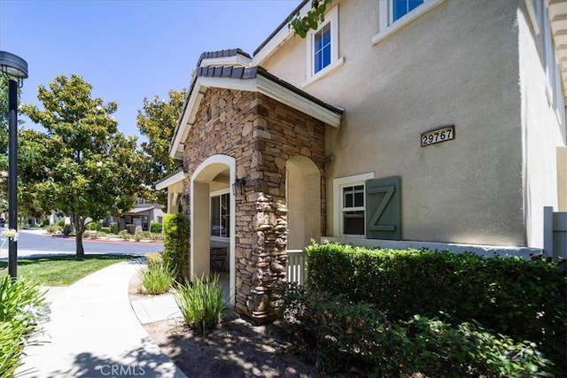 29767 Ascella Ln, Murrieta, CA 92563 - property entrance with stucco siding and stone siding
