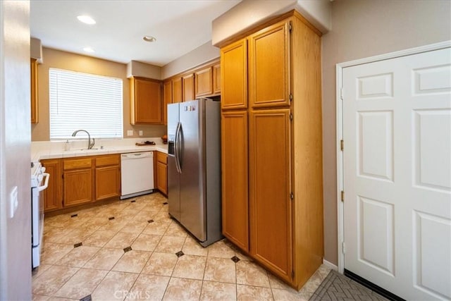 29767 Ascella Ln, Murrieta, CA 92563 - kitchen with white appliances, light tile patterned flooring, brown cabinets, and recessed lighting