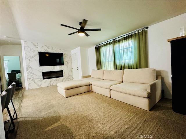 2851 S La Cadena Dr Unit 125, Colton, CA 92324 - living area with carpet floors, ceiling fan, and a premium fireplace