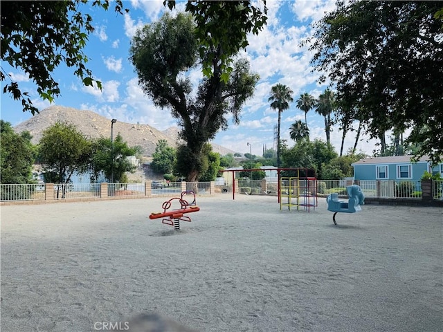 2851 S La Cadena Dr Unit 125, Colton, CA 92324 - view of jungle gym featuring a mountain view