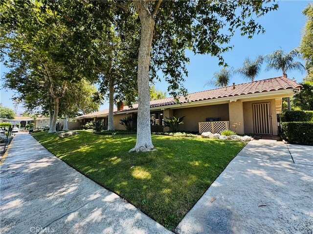 2851 S La Cadena Dr Unit 125, Colton, CA 92324 - ranch-style home featuring stucco siding, a front yard, and a tiled roof