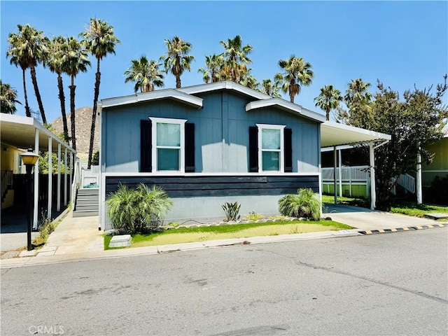 2851 S La Cadena Dr Unit 125, Colton, CA 92324 - manufactured / mobile home featuring an attached carport