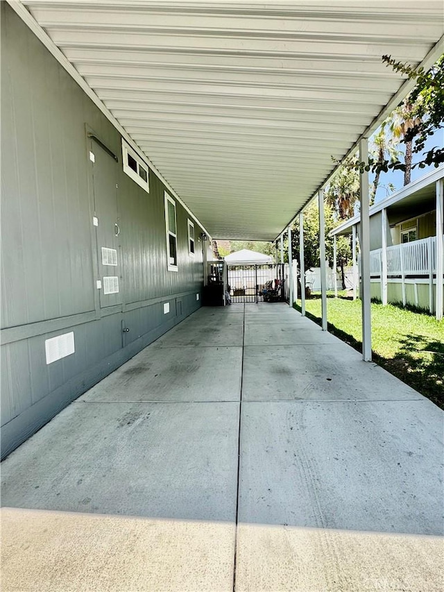 2851 S La Cadena Dr Unit 125, Colton, CA 92324 - view of patio featuring an attached carport