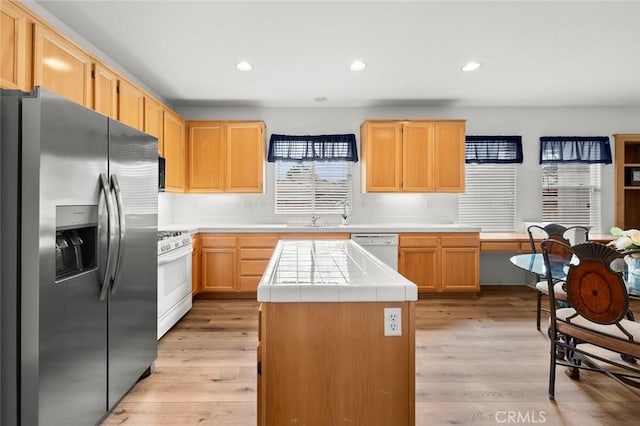 28253 Harmony Ln, Menifee, CA 92584 - kitchen featuring white appliances, tile countertops, light wood-style flooring, recessed lighting, and light brown cabinets