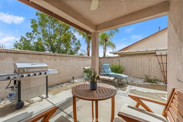 28253 Harmony Ln, Menifee, CA 92584 - fenced backyard with grilling area, a patio area, and a ceiling fan