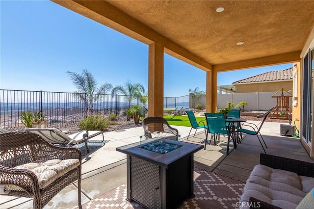 4062 Tamarind Rdg, Lake Elsinore, CA 92530 - fenced backyard with outdoor dining area, a patio area, and an outdoor living space with a fire pit