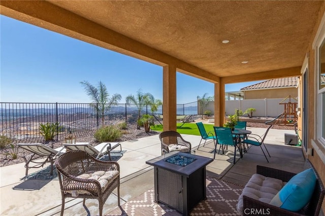 4062 Tamarind Rdg, Lake Elsinore, CA 92530 - fenced backyard featuring an outdoor fire pit, a patio area, and outdoor dining area