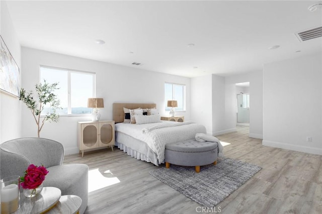4062 Tamarind Rdg, Lake Elsinore, CA 92530 - bedroom with multiple windows and light wood finished floors