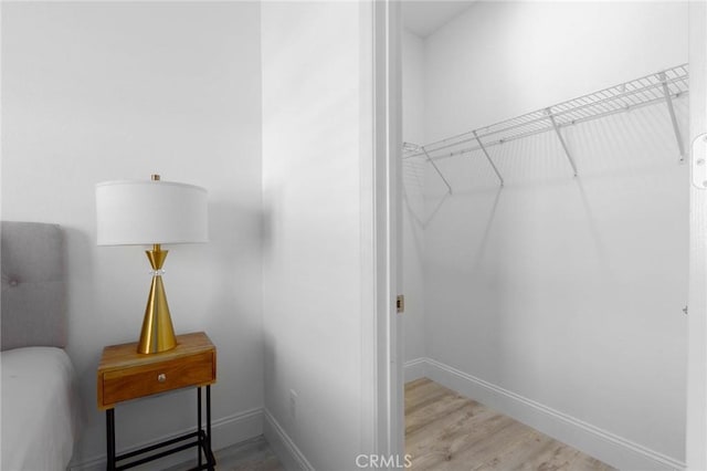 4062 Tamarind Rdg, Lake Elsinore, CA 92530 - walk in closet featuring wood finished floors