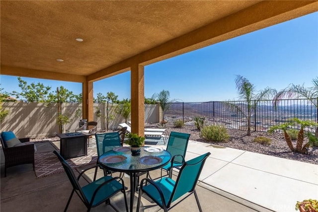 4062 Tamarind Rdg, Lake Elsinore, CA 92530 - fenced backyard with a patio, a fire pit, and outdoor dining area