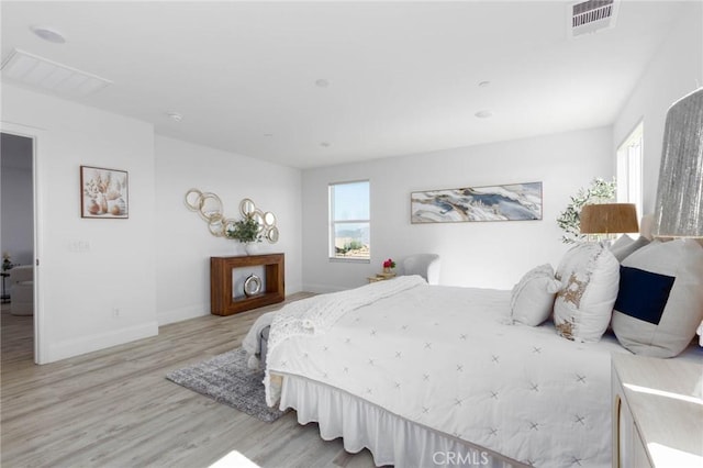 4062 Tamarind Rdg, Lake Elsinore, CA 92530 - bedroom with light wood-style flooring and baseboards