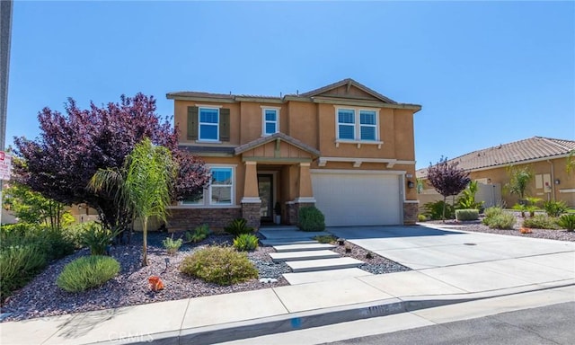 4062 Tamarind Rdg, Lake Elsinore, CA 92530 - view of front of house featuring stone siding, stucco siding, driveway, and an attached garage