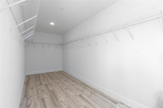 4062 Tamarind Rdg, Lake Elsinore, CA 92530 - spacious closet featuring light wood-style floors
