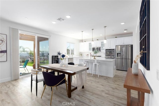 4062 Tamarind Rdg, Lake Elsinore, CA 92530 - dining room with light wood-style flooring and recessed lighting