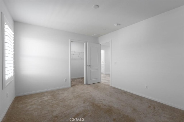 4062 Tamarind Rdg, Lake Elsinore, CA 92530 - unfurnished bedroom with carpet floors, a spacious closet, and a closet