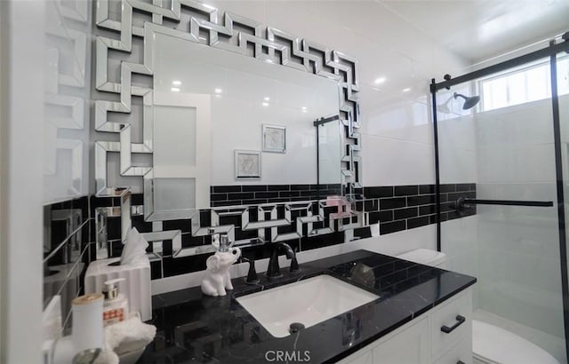 19912 Claretta Ave, Cerritos, CA 90703 - bathroom featuring a stall shower, vanity, and decorative backsplash
