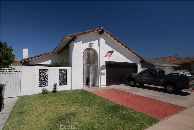 19912 Claretta Ave, Cerritos, CA 90703 - view of front of property featuring a garage, a tiled roof, stucco siding, decorative driveway, and a gate
