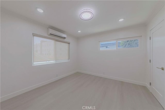 645 N Gramercy Pl, Los Angeles, CA 90004 - empty room with a wall unit AC, ornamental molding, light wood-type flooring, and recessed lighting