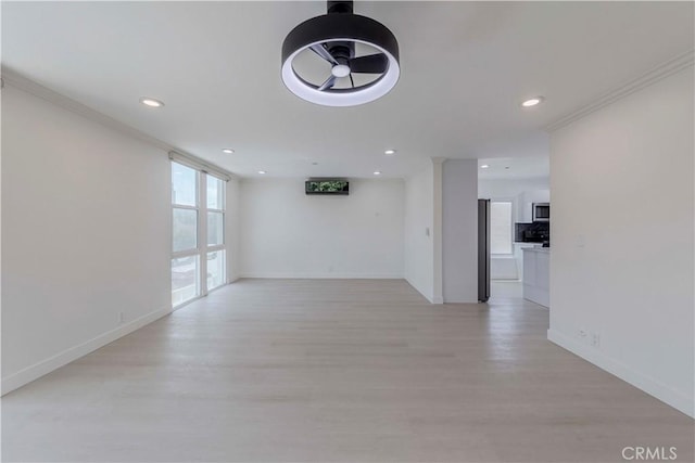 645 N Gramercy Pl, Los Angeles, CA 90004 - empty room featuring recessed lighting, light wood-type flooring, and ornamental molding