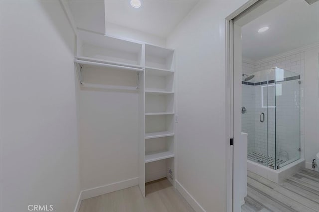 645 N Gramercy Pl, Los Angeles, CA 90004 - walk in closet with wood finished floors
