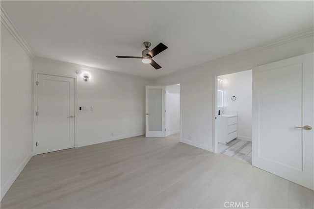 645 N Gramercy Pl, Los Angeles, CA 90004 - unfurnished bedroom featuring ornamental molding, light wood-style flooring, connected bathroom, and a ceiling fan