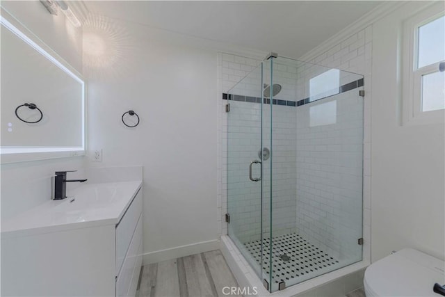 645 N Gramercy Pl, Los Angeles, CA 90004 - full bathroom with vanity, a stall shower, ornamental molding, and wood finished floors