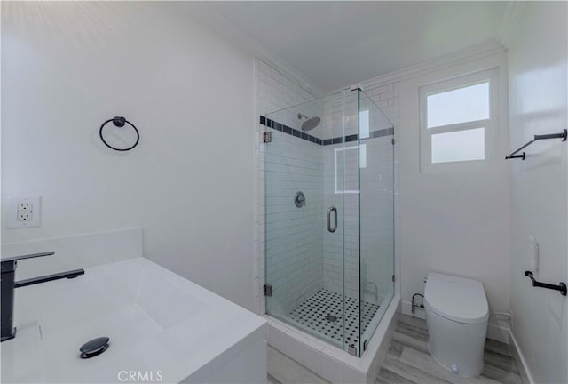 645 N Gramercy Pl, Los Angeles, CA 90004 - bathroom with a shower stall, ornamental molding, and wood finished floors