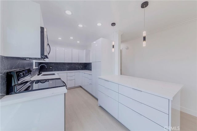 645 N Gramercy Pl, Los Angeles, CA 90004 - kitchen featuring modern cabinets, tasteful backsplash, recessed lighting, white cabinetry, and decorative light fixtures