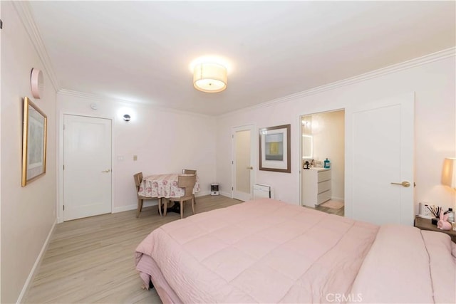 645 N Gramercy Pl, Los Angeles, CA 90004 - bedroom featuring ornamental molding, wood finished floors, and ensuite bath