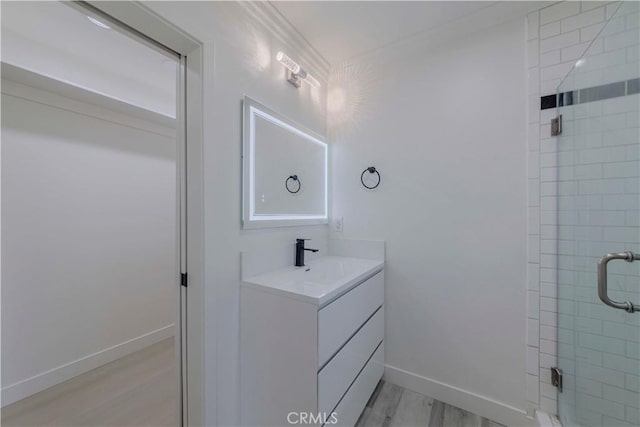 645 N Gramercy Pl, Los Angeles, CA 90004 - bathroom with vanity, wood finished floors, and a shower stall