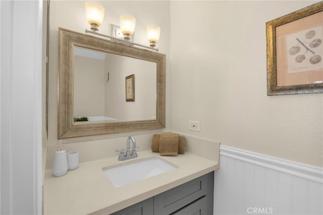 1047 E Huntington Dr Unit D, Monrovia, CA 91016 - bathroom featuring vanity, a wainscoted wall, and a decorative wall