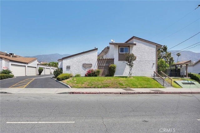 1047 E Huntington Dr Unit D, Monrovia, CA 91016 - view of front of home featuring a mountain view and a front lawn