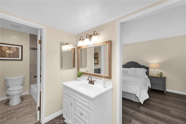 1047 E Huntington Dr Unit D, Monrovia, CA 91016 - full bathroom featuring vanity, wood finished floors, and tub / shower combination