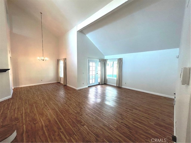 12180 Westerly Trl, Moreno Valley, CA 92557 - unfurnished living room featuring a chandelier, high vaulted ceiling, and dark wood-style flooring
