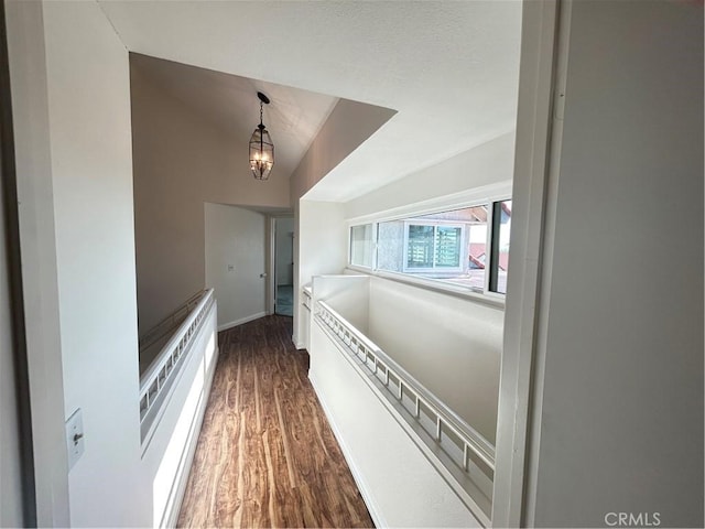 12180 Westerly Trl, Moreno Valley, CA 92557 - hall featuring lofted ceiling, dark wood finished floors, and a chandelier