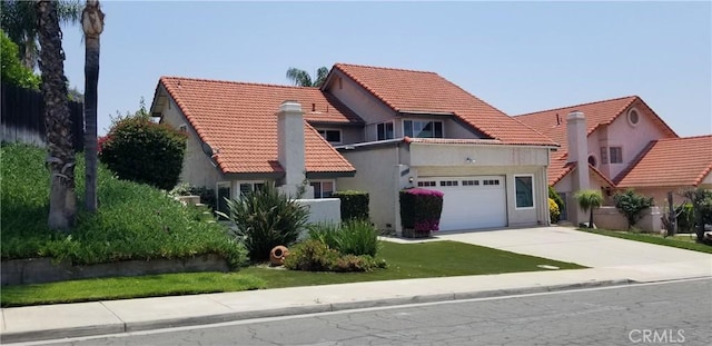 12180 Westerly Trl, Moreno Valley, CA 92557 - mediterranean / spanish-style house with a tiled roof, driveway, a garage, and stucco siding