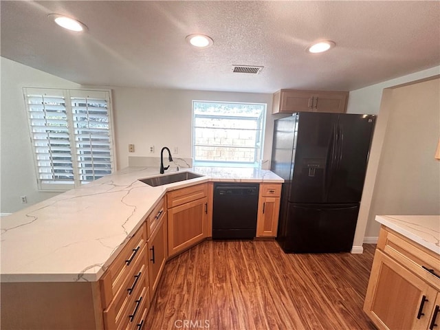 12180 Westerly Trl, Moreno Valley, CA 92557 - kitchen with black appliances, dark wood-style floors, light stone counters, recessed lighting, and a textured ceiling