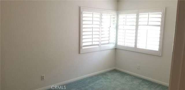 12180 Westerly Trl, Moreno Valley, CA 92557 - carpeted spare room featuring baseboards